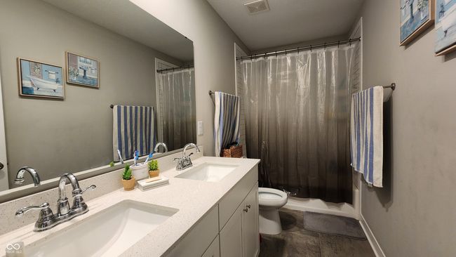 bathroom featuring double vanity and stone finish floors | Image 18