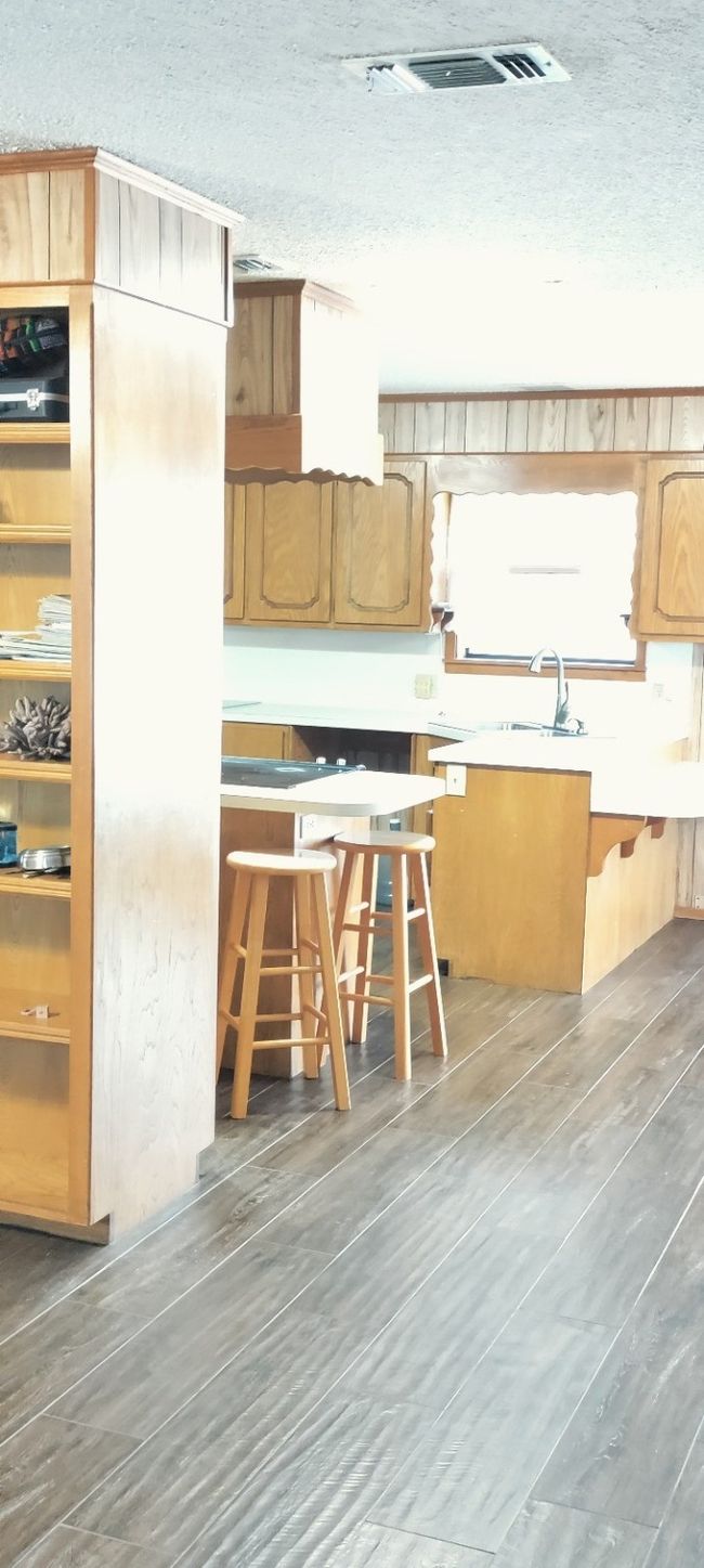 Kitchen with a textured ceiling and wood finished floors | Image 22