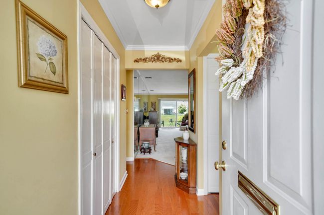 Entryway featuring light wood-type flooring and ornamental molding | Image 10