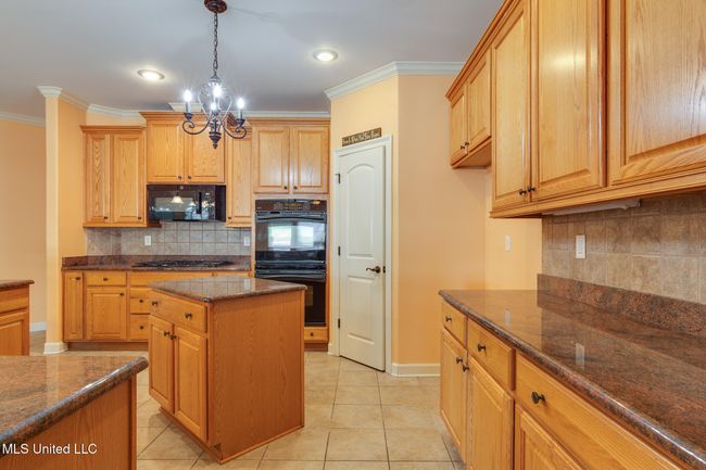 abundance of counters and cabinets | Image 19