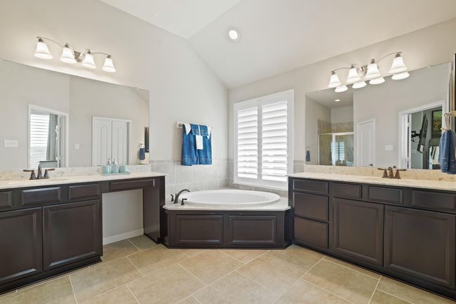 This spacious bathroom provides the perfect setting for a spa-like retreat, efficient morning routines, or a tranquil escape. | Image 22