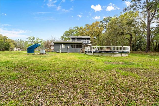 Backyard with pool. | Image 18