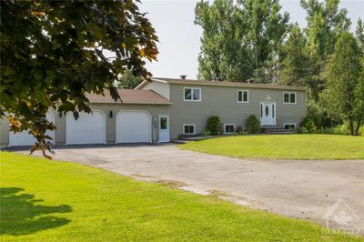 Experience rural tranquility & modern functionality in this beautifully well maintained 3+3 bedrm & 3 full bath home. | Image 1