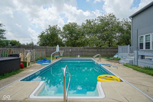 view of pool featuring a fenced backyard, a deck, and a patio | Image 41