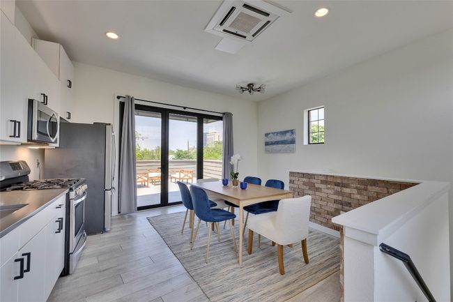 Dining room featuring light wood-style flooring and recessed lighting | Image 18