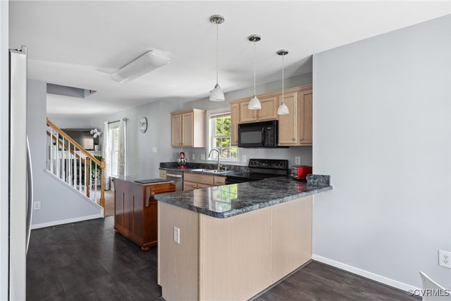 The breakfast bar can easily fit 2 chairs | Image 20
