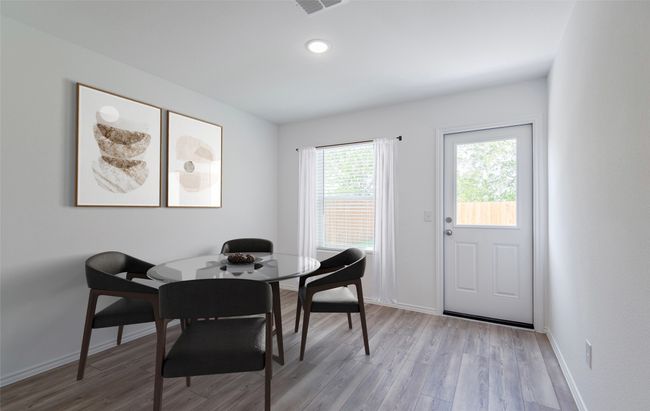 Dining area with access to backyard *Photos of furnished model. Not actual home. Representative of floor plan. Some options and features may vary | Image 5