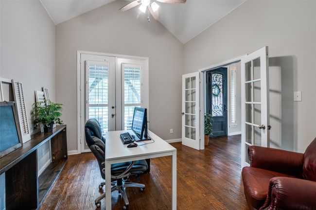 Home office featuring french doors, a ceiling fan, hand scraped hardwoods, high vaulted ceiling and french doors leading to the front patio area | Image 37