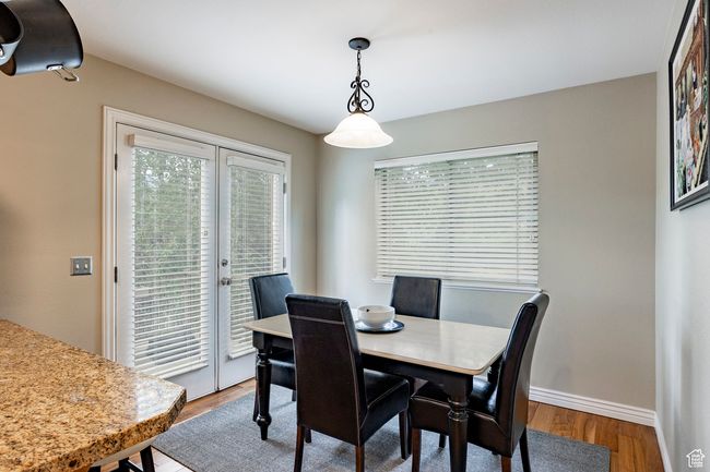 Living area with recessed lighting, a healthy amount of sunlight, hardwood / wood-style flooring, and french doors | Image 7