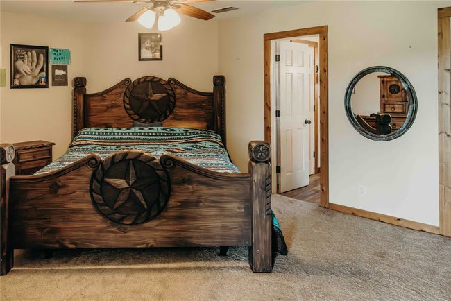 Bedroom featuring carpet and ceiling fan | Image 21