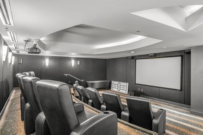 Carpeted cinema room with a raised ceiling | Image 18