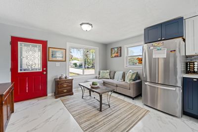 Open concept living room with brand new flooring and kitchen remodel | Image 3