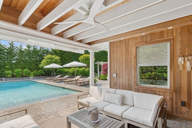 Outdoor pool featuring a patio area, a ceiling fan, and outdoor lounge area | Image 27