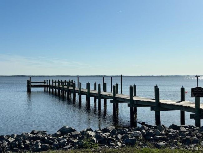 Dock area featuring a water view | Image 9