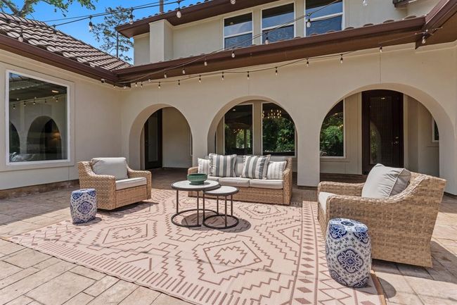 Additional seating and entertaining space are waiting for you in this majestic backyard oasis. | Image 37