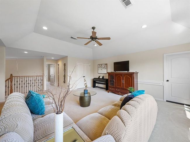 Expansive upstairs game room perfect for entertainment and relaxation. | Image 40