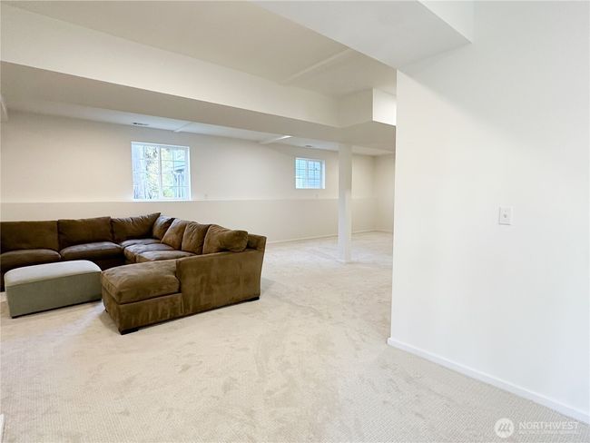 The huge daylight basement was recently finished with fresh carpet. | Image 31