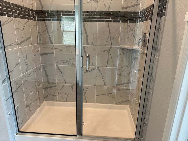 Bathroom with a shower stall | Image 9