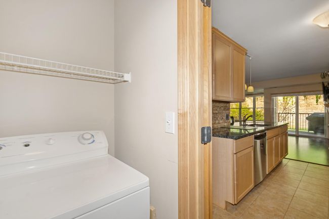 The laundry room is thoughtfully tucked away to reduce noise and enhance convenience. | Image 7