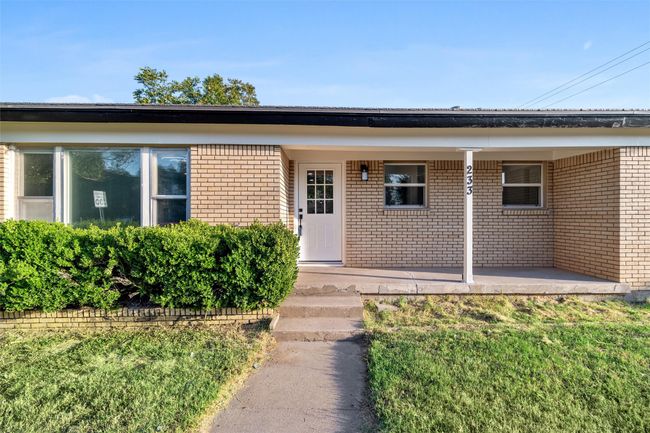 Doorway to property featuring a yard | Image 40