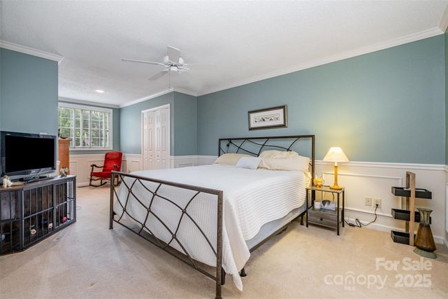 Large bedroom on second floor has two closets and a sitting area | Image 18