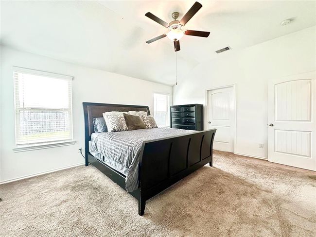 Primary bedroom with abundant natural light and room for large furniture | Image 13