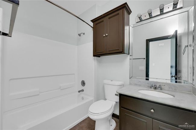 Full bath with toilet, vanity, and shower / washtub combination | Image 7