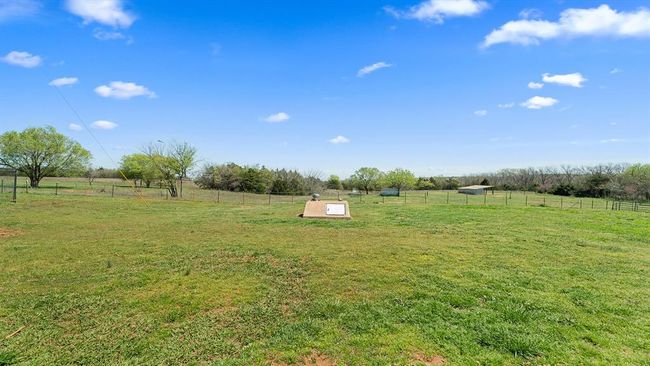 View of yard with a rural view and fence | Image 18