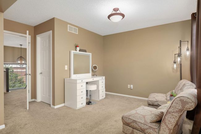 Primary bedroom sitting area and two walk-in closets | Image 22