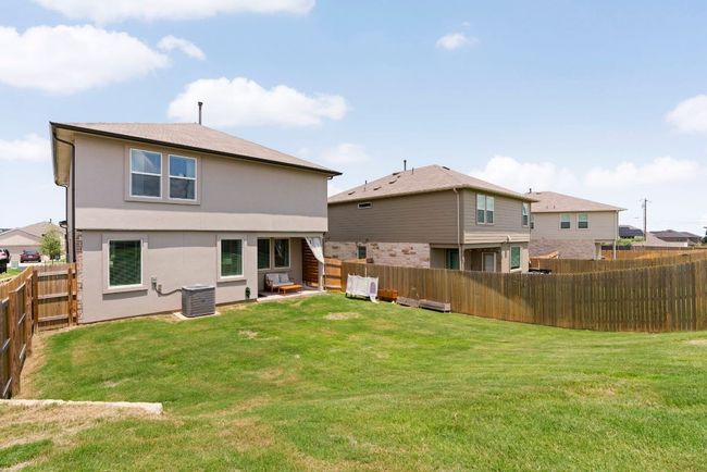 Rear view of house featuring a fenced backyard and stucco siding | Image 30