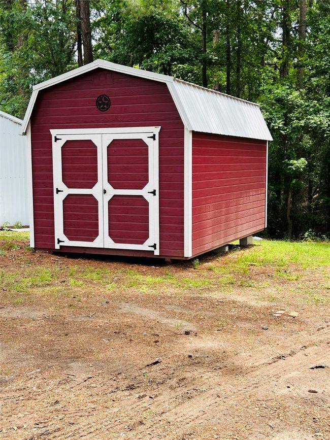 View of shed featuring view of scattered trees | Image 12