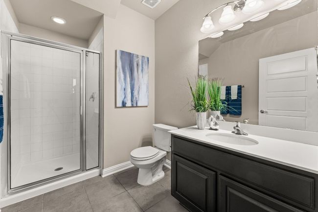 Full bathroom with vanity, a stall shower, tile patterned floors, and recessed lighting | Image 18