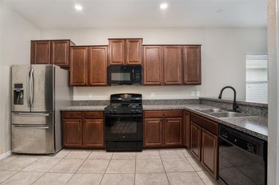 Large open kitchen with tons of cabinet space | Image 3