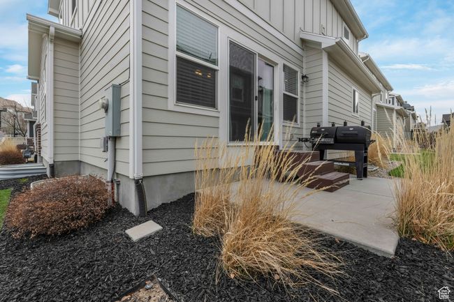 View of side of property featuring board and batten siding and a patio area | Image 20