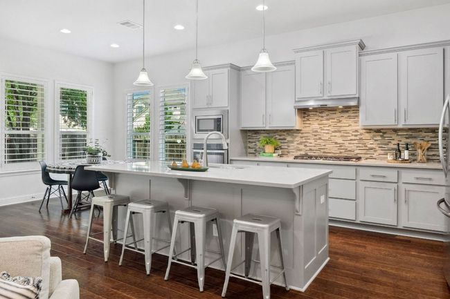 At the heart of the home, the kitchen stands as a stunning centerpiece. | Image 12