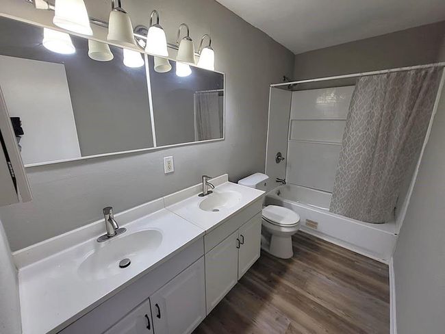 Guest bathroom with double sinks & tub/shower combo | Image 15