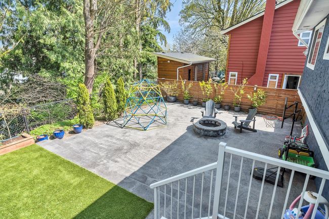 View of patio featuring a fire pit and a fenced backyard | Image 37