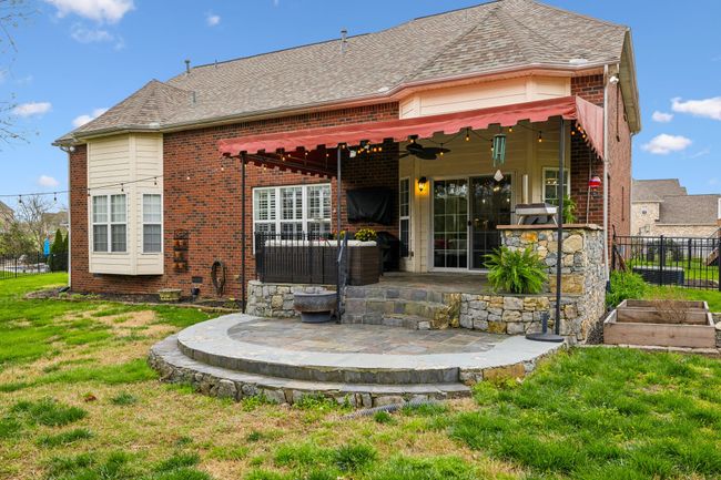 This custom slate patio is the perfect space for outdoor living | Image 44