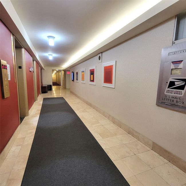 Hall featuring elevator and light tile patterned floors | Image 18