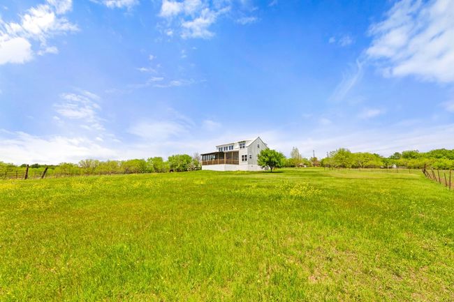 View of yard featuring fence and a rural view | Image 39