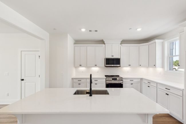 Imagine having the family over for dinner with this kitchen-- be prepared to be the envy of your friends and loved ones! Actual photo of home. | Image 11