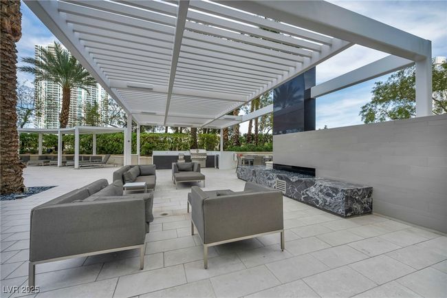 View of patio / terrace featuring a pergola, an outdoor hangout area, and grilling area | Image 70