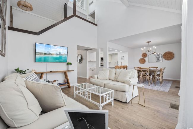 Open floor plan to dining, kitchen and back deck | Image 5