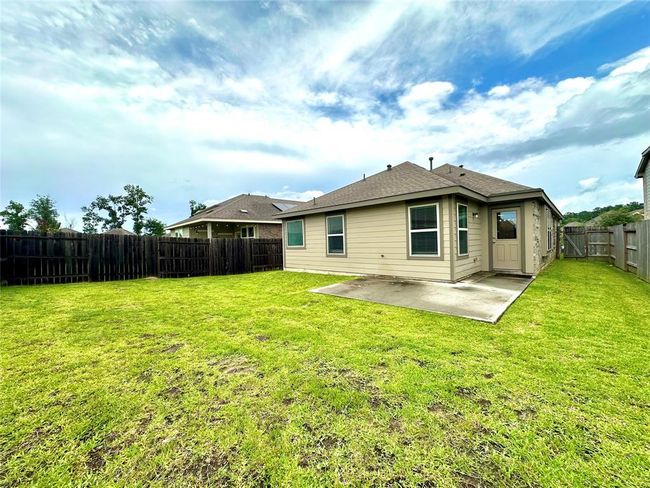 Fully fenced and fully sodded backyard with lots of space for unwinding and entertaining. | Image 24