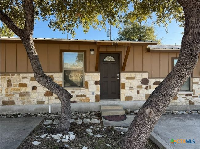 Each apartment has own entrance and back patio. Another view of apartment community. | Image 4
