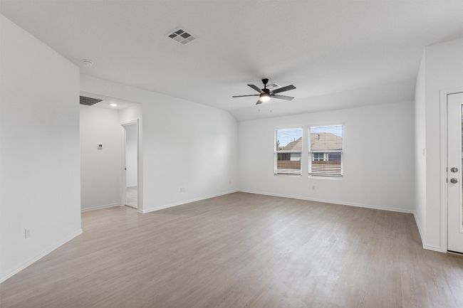 Unfurnished room featuring a ceiling fan and light wood-type flooring | Image 9
