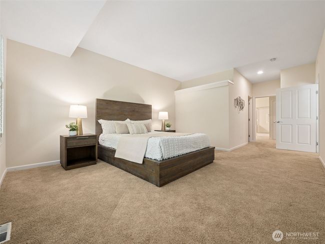 Spacious primary suite acccomodates a king sized bed, multiple dressers and even a big cozy reading chair, if you wish! | Image 16