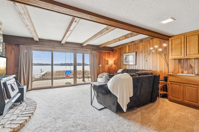 Lower level family room with walk-out access to the expansive patio | Image 25