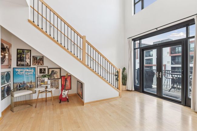 The living room being lofted elevates the space & adds so much natural light to it. | Image 9