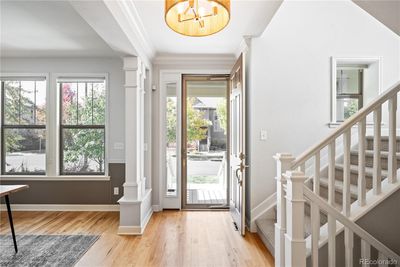 Beautiful Entryway with updated lighting and hickory wood flooring | Image 3